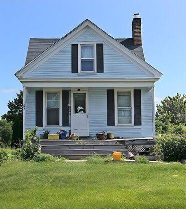 Home exterior before siding restoration